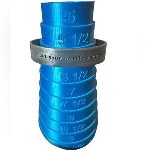 Lisa Leonard silver “I hold your heart in mine” cuff bracelet.